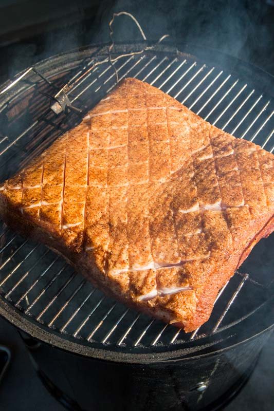 seasoned pork belly on smoker