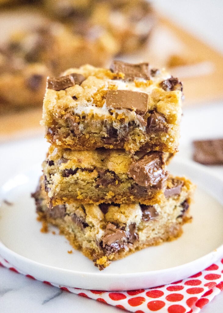 stacked s'mores bars on a white plate