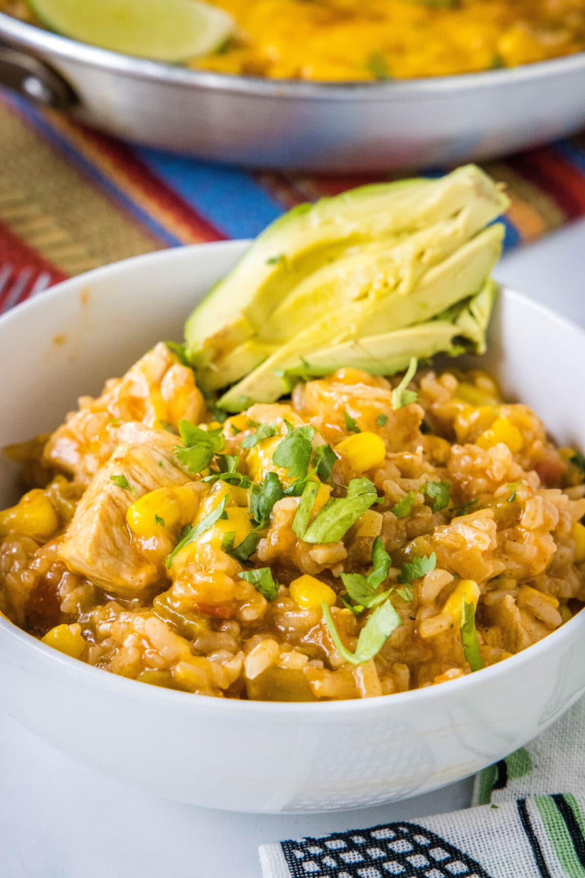 southwest chicken skillet in a a bowl with avocado
