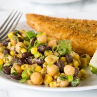 Southwestern Chickpea Salad - chickpeas and black beans with corn and avocado in a Southwestern style dressing. A great healthy and fresh summer side dish. 