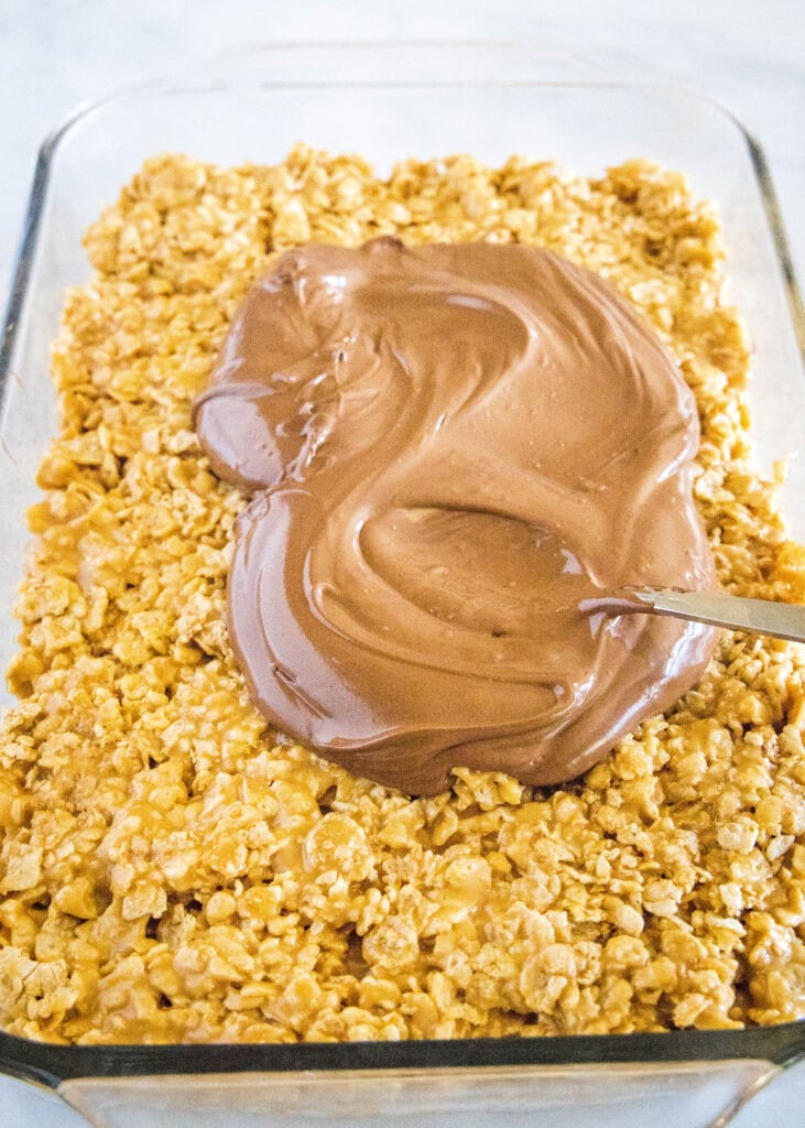 pouring chocolate over special k bars