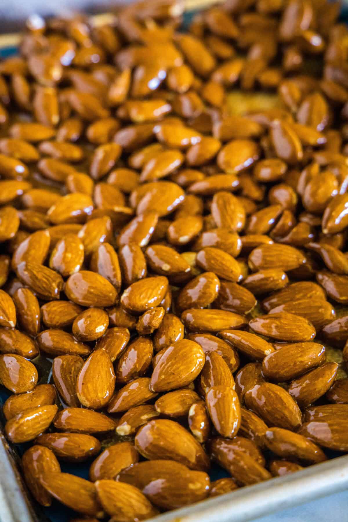 honey roasted almonds on a baking sheet
