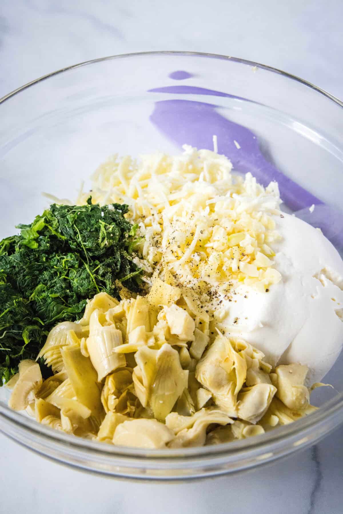 spinach stuffed shell filling in a mixing bowl