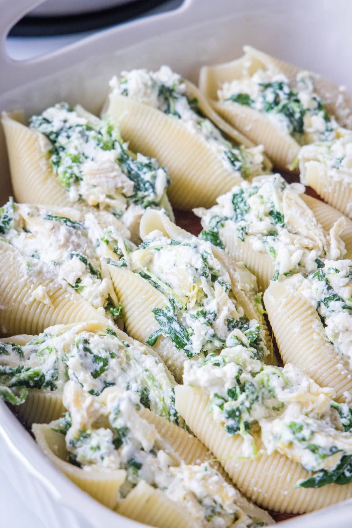 spinach stuffed shells in a baking dish