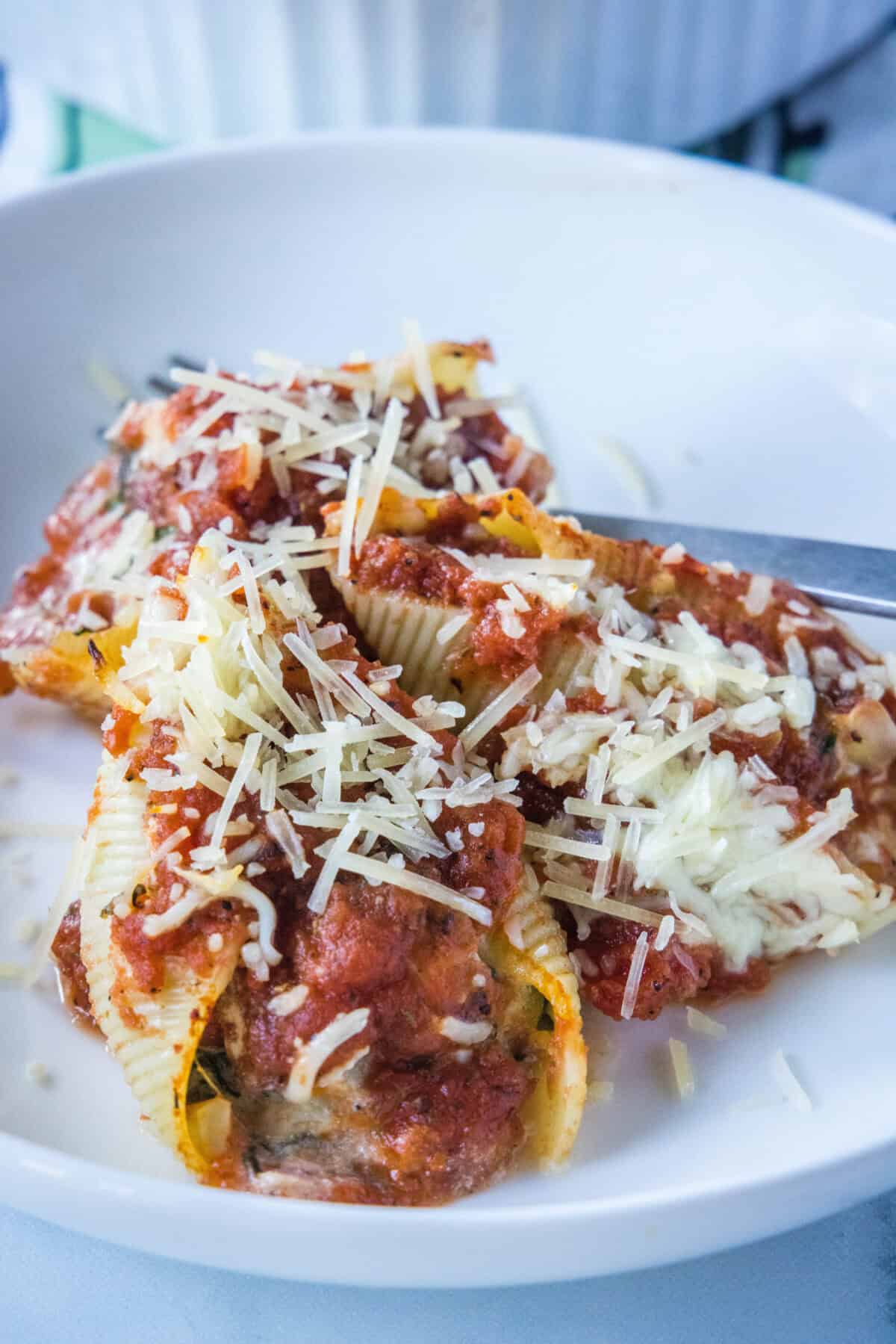 plate with stuffed shells on it