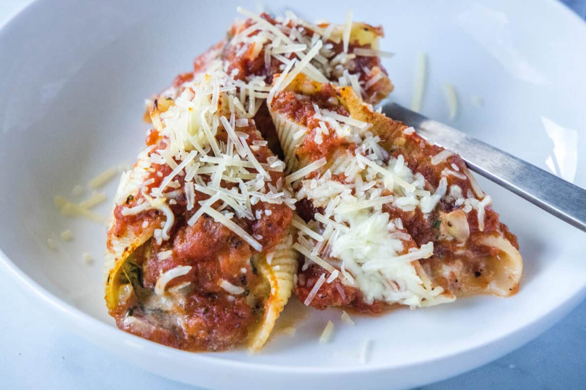 Spinach Stuffed Shells – Jumbo pasta shells are filled with a creamy mix of ricotta, spinach, and artichokes, then baked in a smoky fire-roasted tomato sauce until bubbly.