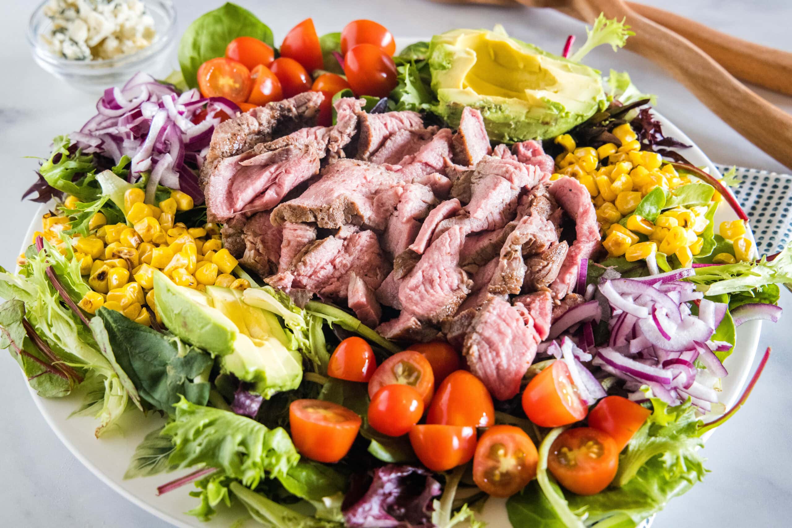 Steak salad served on a large platter.
