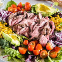 Steak salad served on a large platter.