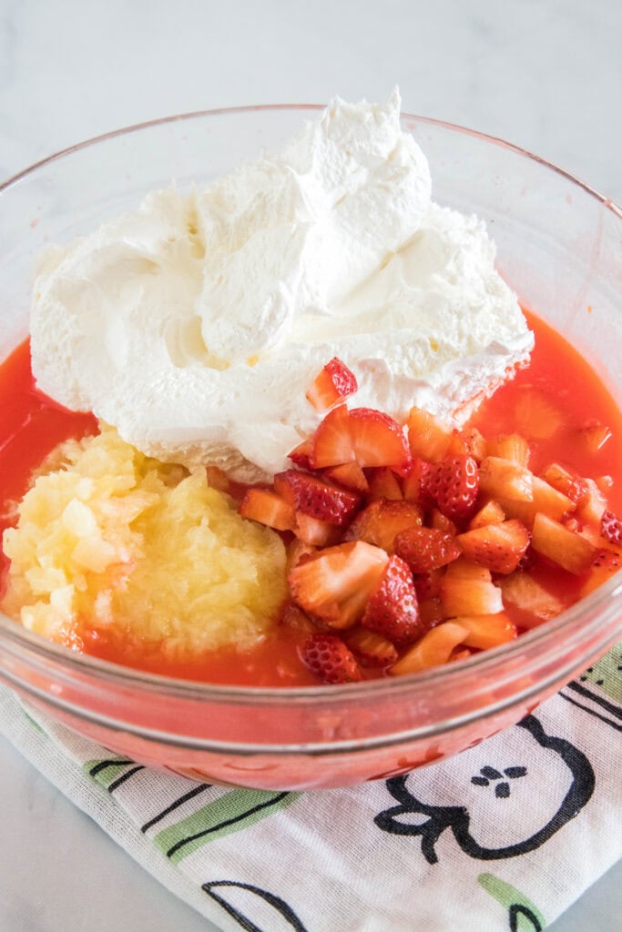 Strawberry fluff ingredients combined in a bowl.
