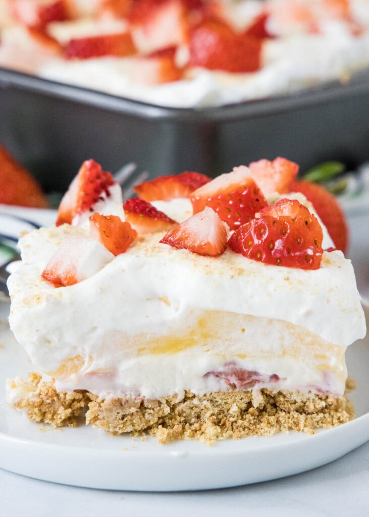 slice of strawberry lush dessert on a white plate