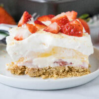close up strawberry lasagna on a white plate