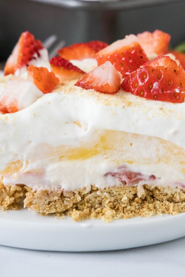 close up strawberry lasagna on a white plate