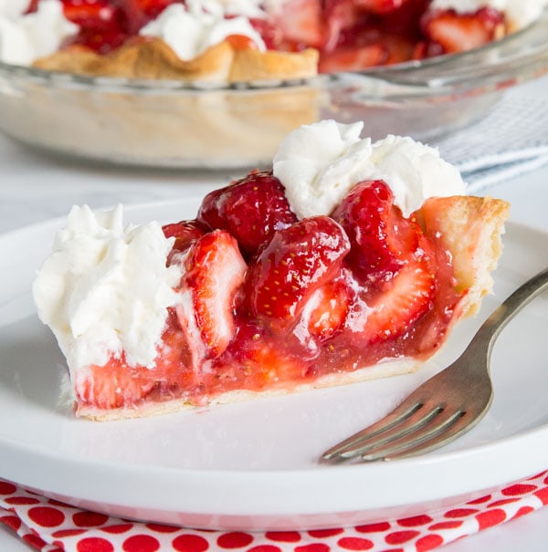 A slice of cake on a plate, with Pie and Strawberry