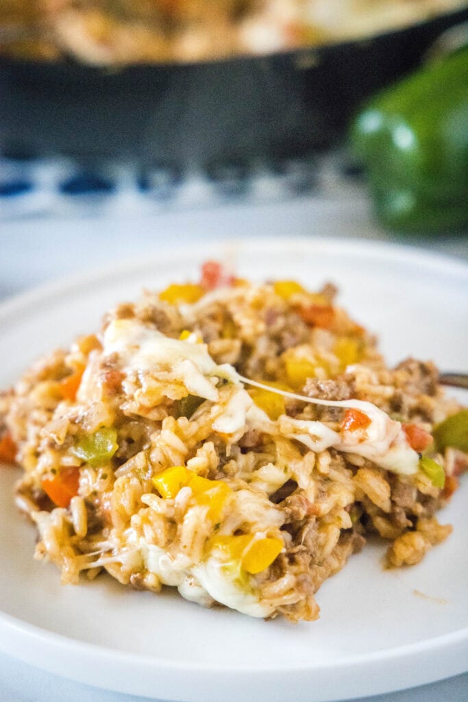 a white plate with stuffed pepper casserole on it