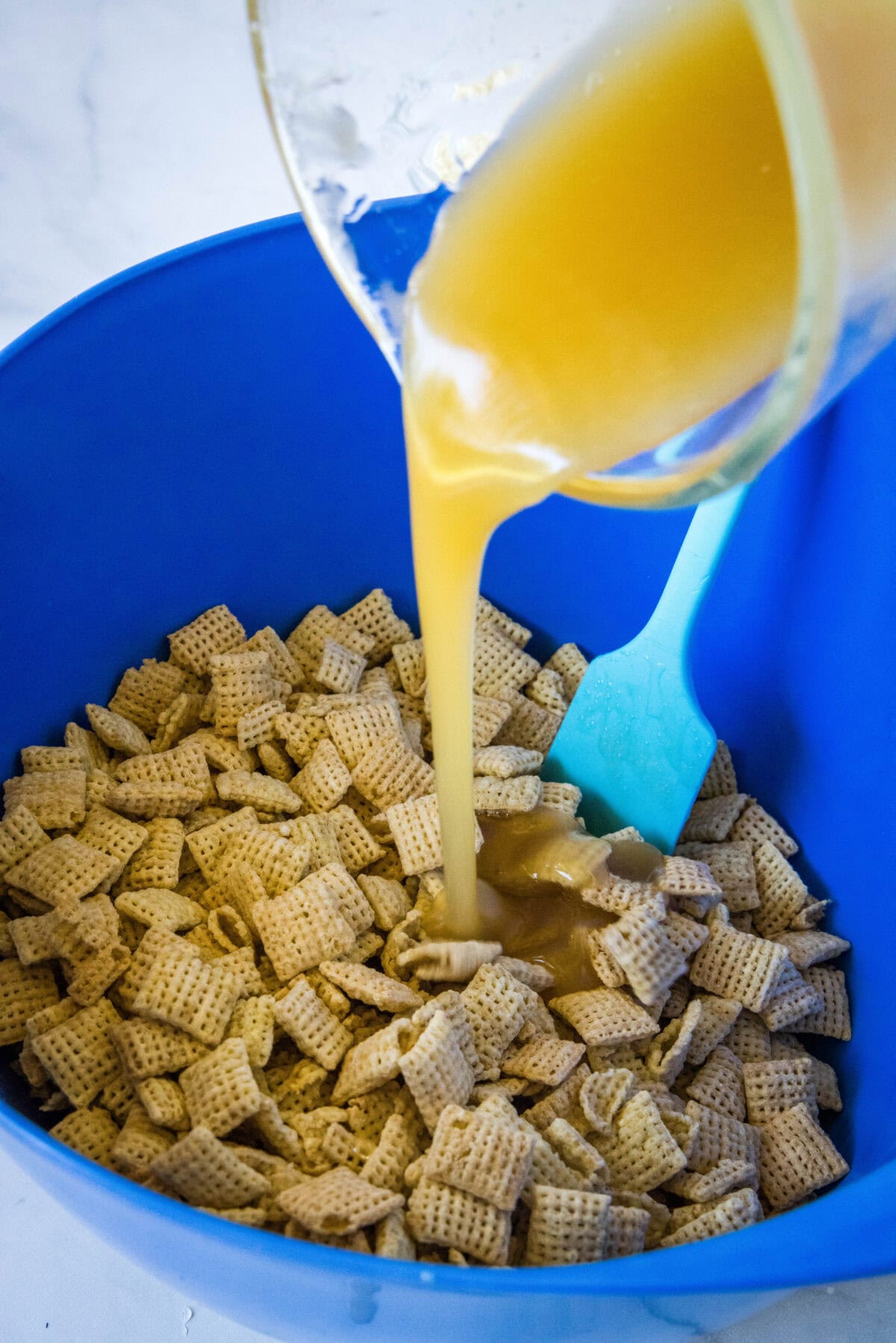 pouring sugar mixture over cereal