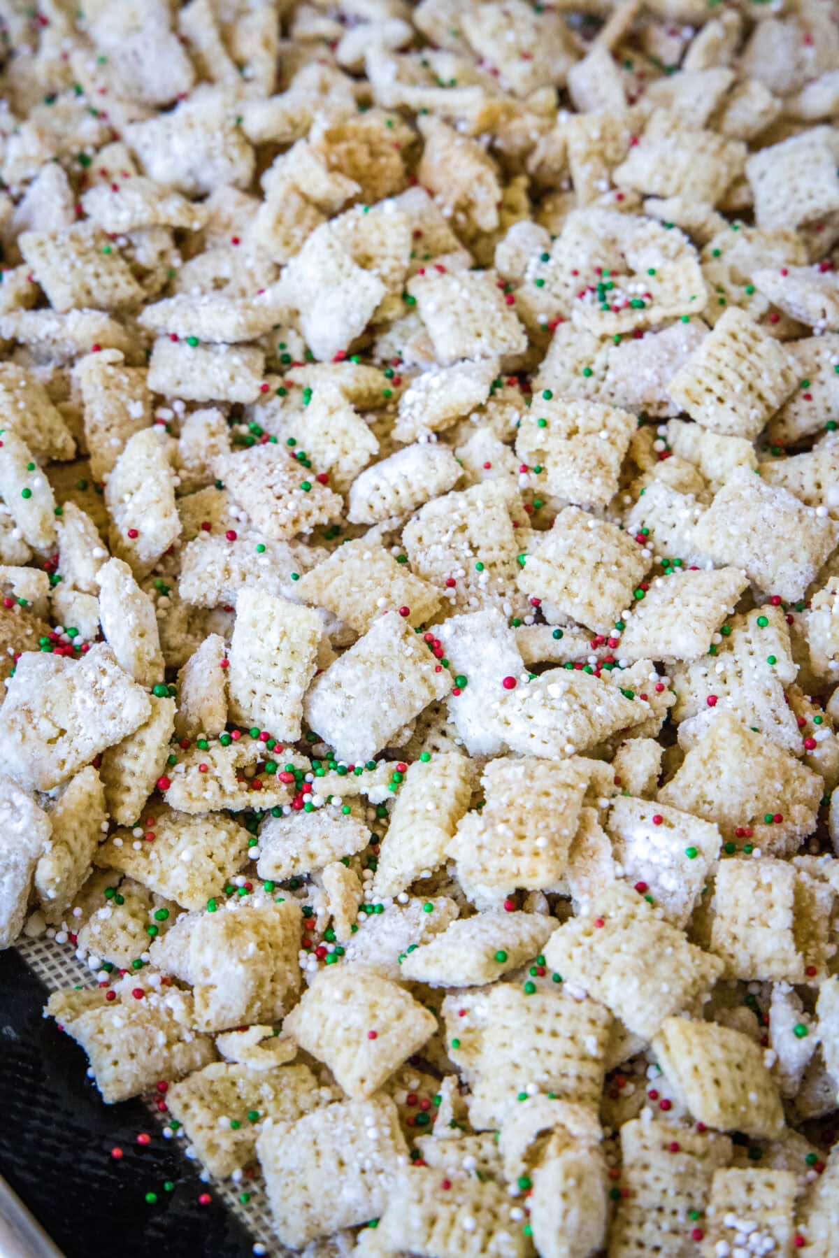 sugar cookie chex mix on baking sheet
