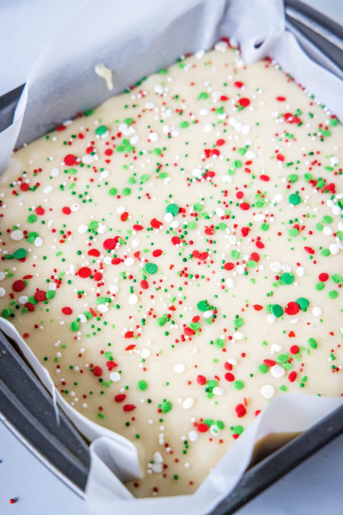 adding sprinkles to the sugar cookie fudge