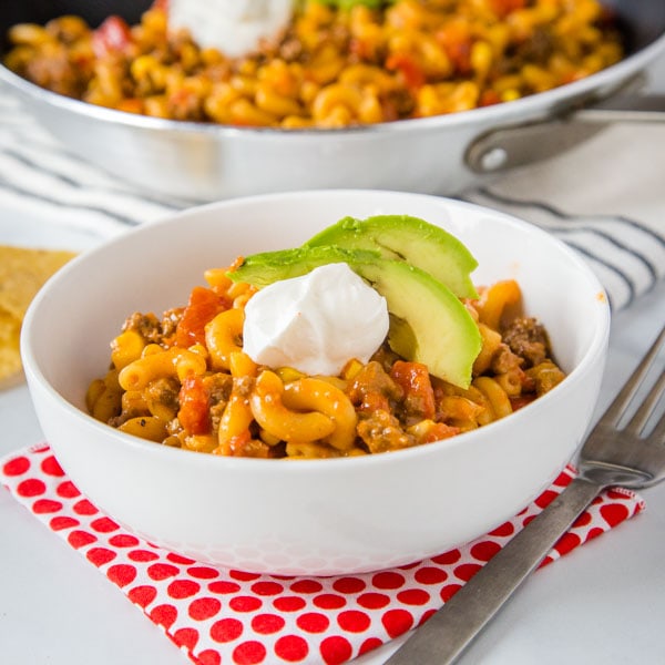 Taco Pasta Skillet - All the flavors of taco night in a one pan meal, ready in 20 minutes! Homemade version of taco Hamburger Helper, with just a few staple ingredients.