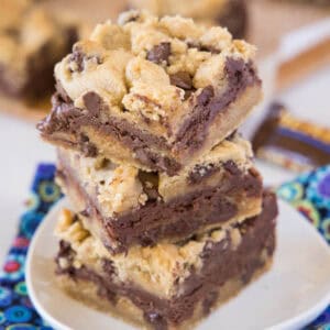 stacked toffee chocolate chip bars on a white plate
