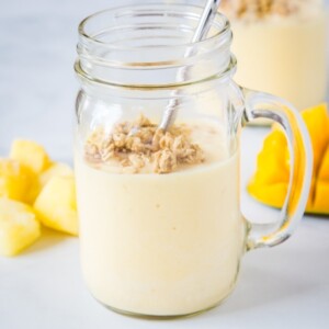 Mango Pineapple Smoothie - this tropical smoothie is a refreshing smoothie full of pineapple, mango, orange and lime juice. It is like vacation for breakfast!