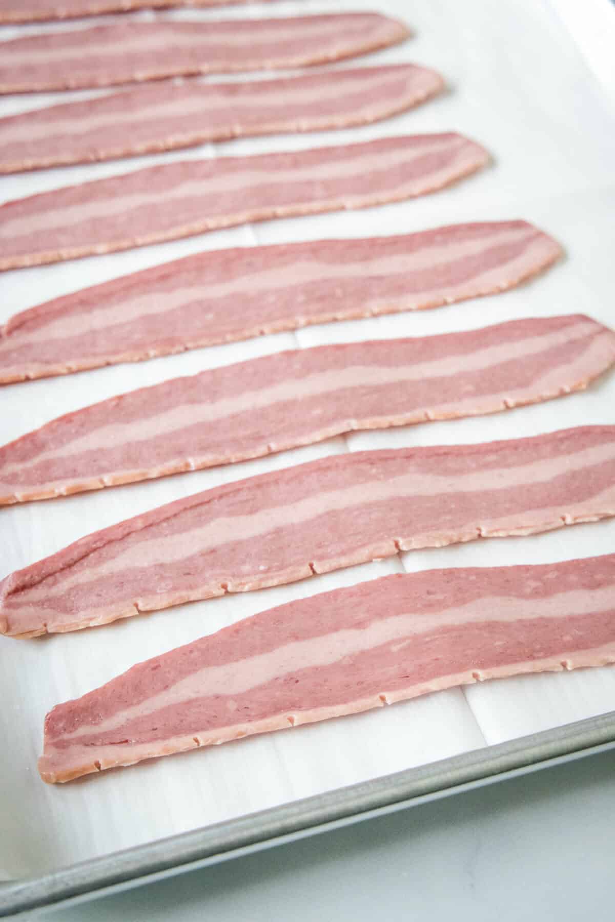 arranging turkey bacon on sheet pan