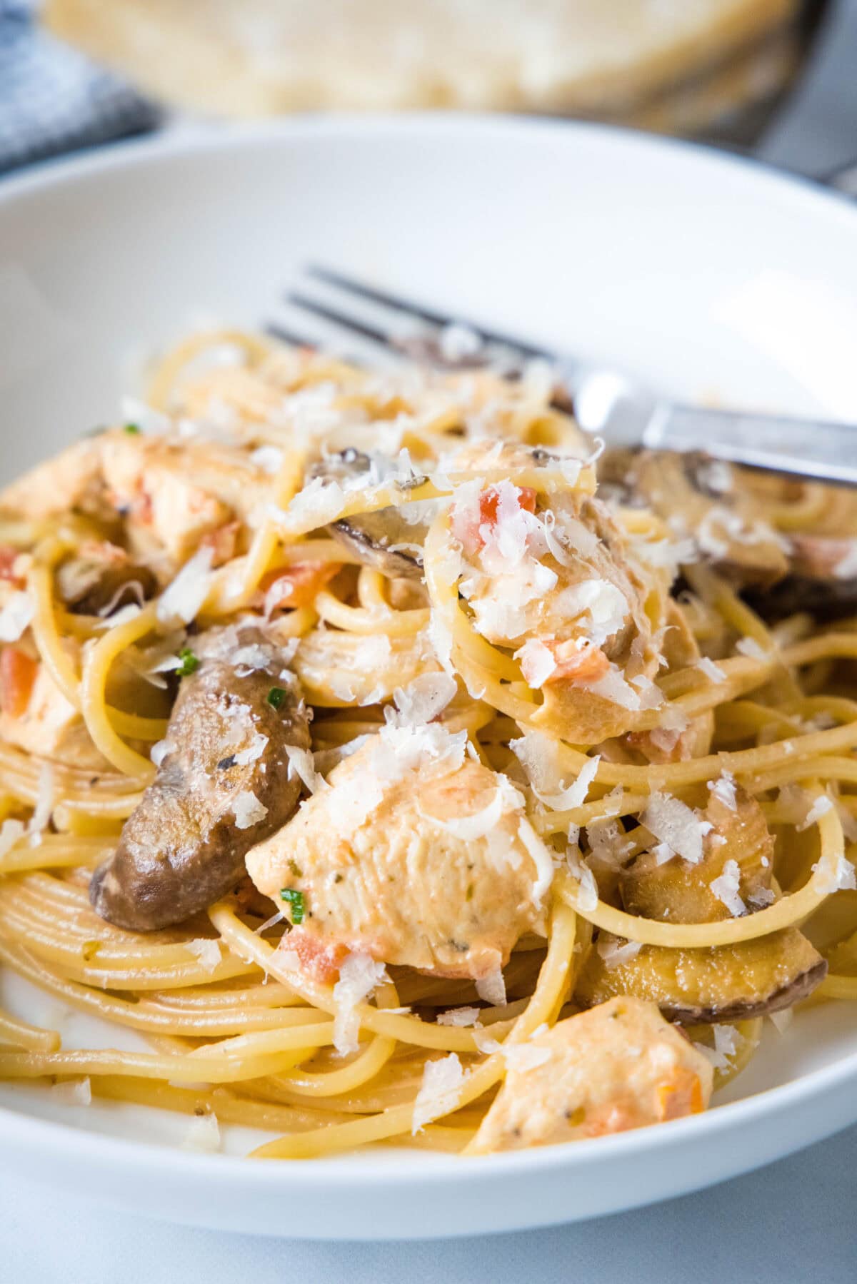 a serving bowl with chicken pasta