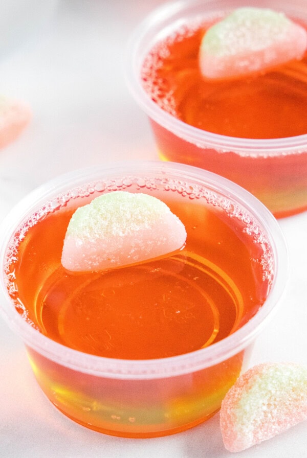 cropped close up of watermelon jello shots on a table
