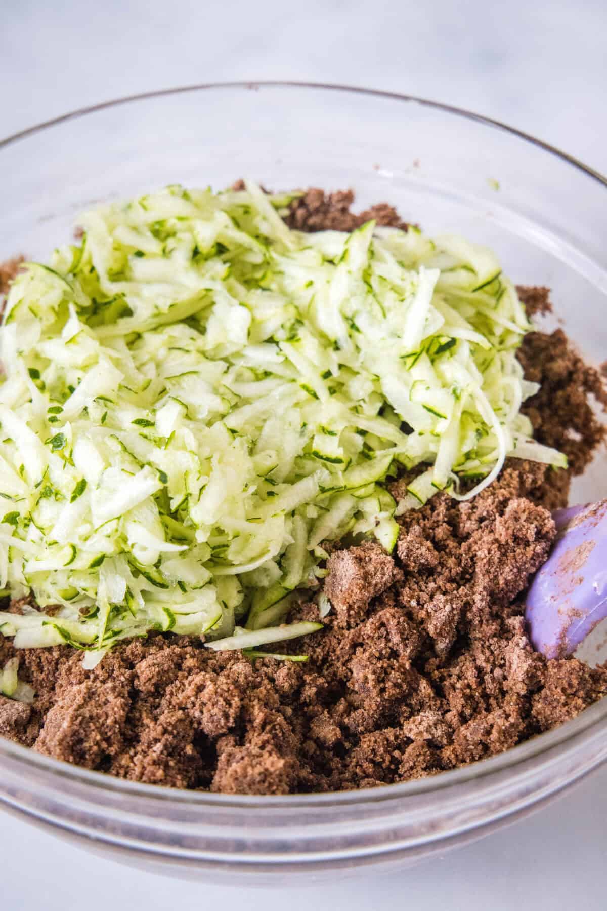 adding shredded zucchini to brownies