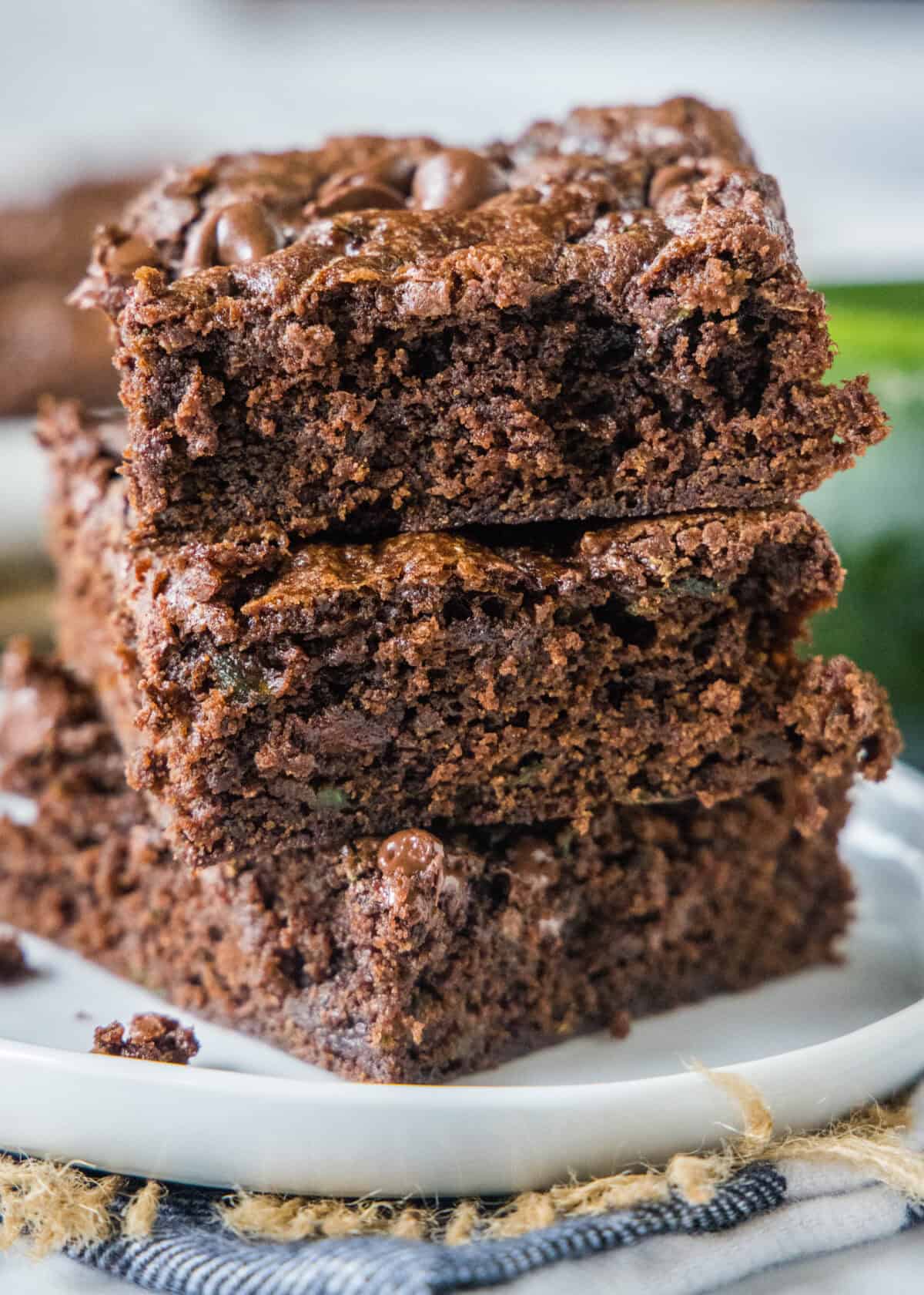 3 zucchini brownies stacked on top of each other